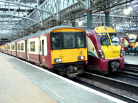 318270 and 334033 at Glasgow Central