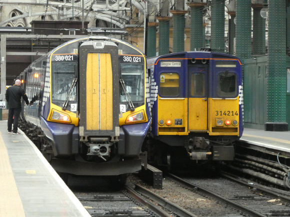 380021 and 314214 at Glasgow Central