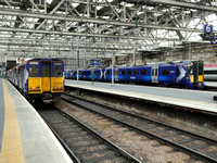 314214 and 385029 at Glasgow Central
