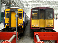 156495 and 314210 at Glasgow Central