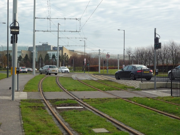 Grassed track and road crossing at Gyle tram stop